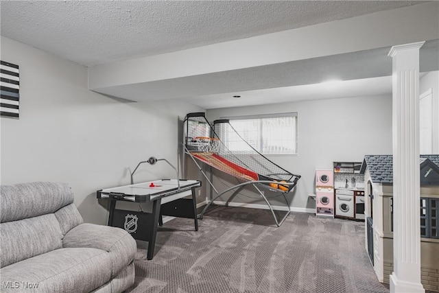playroom featuring baseboards, decorative columns, a textured ceiling, and carpet flooring
