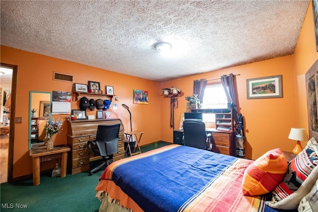 bedroom with carpet flooring, a textured ceiling, and visible vents