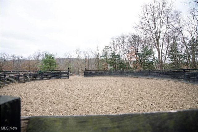 view of property's community featuring fence and an enclosed area