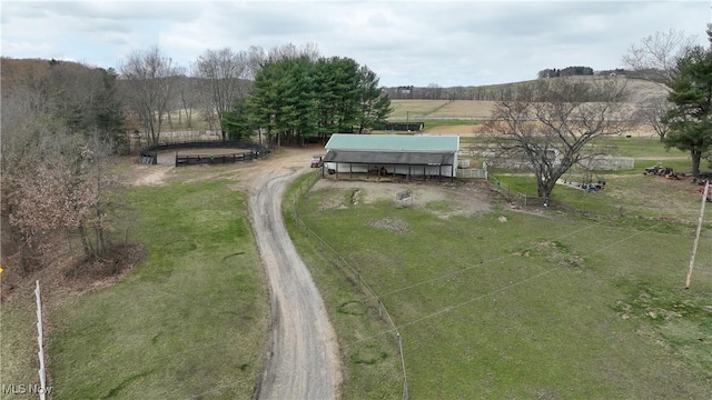 birds eye view of property with a rural view