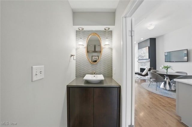 bathroom featuring wood finished floors and vanity