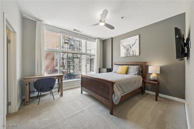1951 W 26th St Unit Th5, Cleveland, OH 44113 - carpeted bedroom featuring baseboards and a ceiling fan