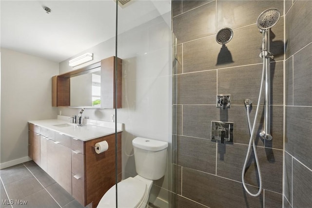1951 W 26th St Unit Th5, Cleveland, OH 44113 - bathroom with toilet, a tile shower, vanity, and tile patterned flooring