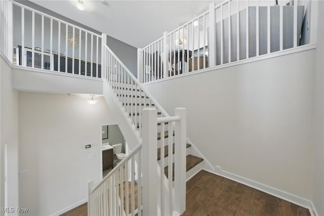 1951 W 26th St Unit Th5, Cleveland, OH 44113 - stairway featuring wood finished floors, baseboards, and a towering ceiling