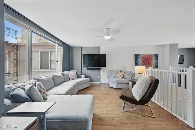 1951 W 26th St Unit Th5, Cleveland, OH 44113 - living area featuring ceiling fan, wood finished floors, and baseboards
