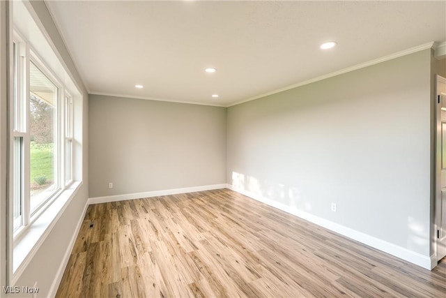 unfurnished room featuring baseboards, recessed lighting, ornamental molding, and light wood-style flooring
