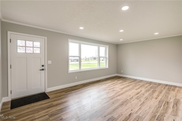 entrance foyer with baseboards, recessed lighting, wood finished floors, and crown molding