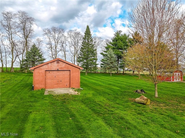 view of yard with an outdoor structure and a garage