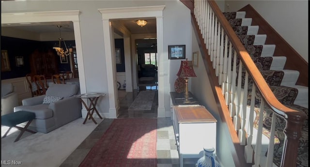 interior space featuring a chandelier and crown molding