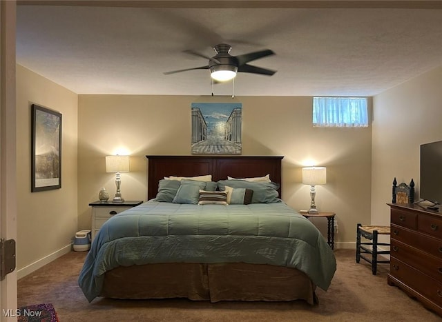 bedroom with baseboards, a ceiling fan, and carpet floors