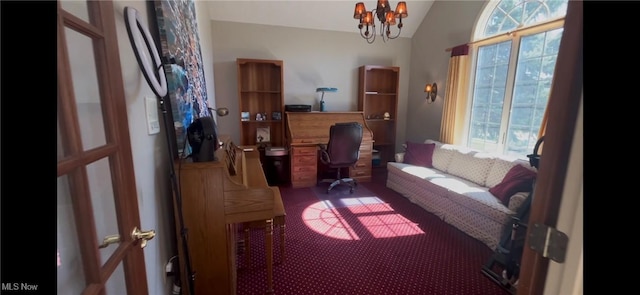 office area featuring a notable chandelier, carpet, and vaulted ceiling