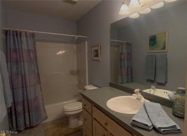 bathroom featuring tile patterned floors, toilet, vanity, visible vents, and shower / tub combo