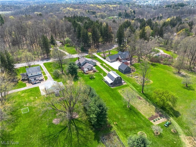 drone / aerial view featuring a forest view