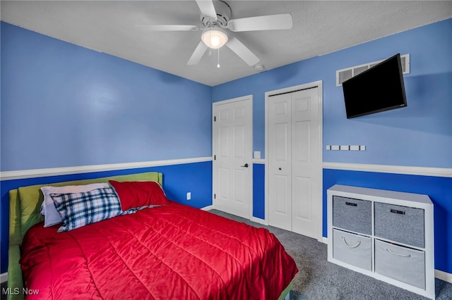 bedroom featuring ceiling fan, a closet, carpet flooring, and baseboards
