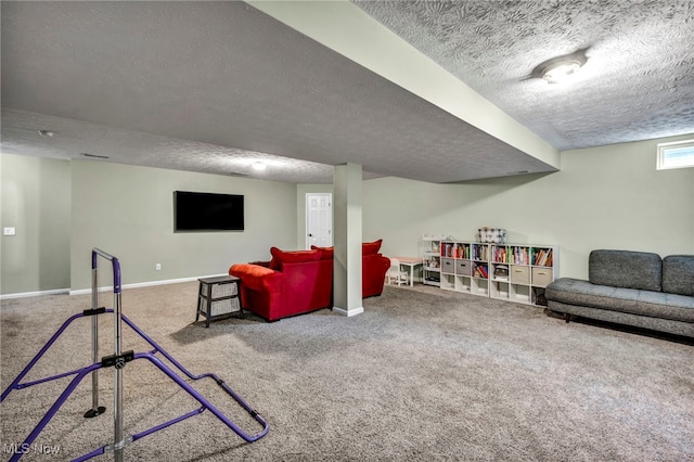 game room featuring a textured ceiling, carpet, and baseboards