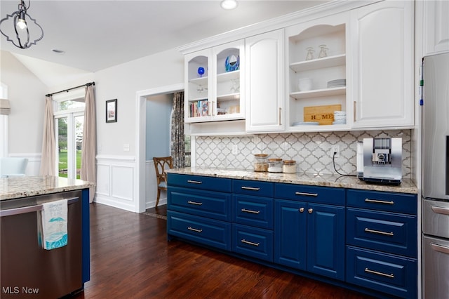 kitchen with white cabinetry, blue cabinetry, and appliances with stainless steel finishes