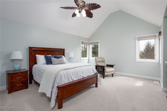 bedroom with baseboards, lofted ceiling, and light colored carpet