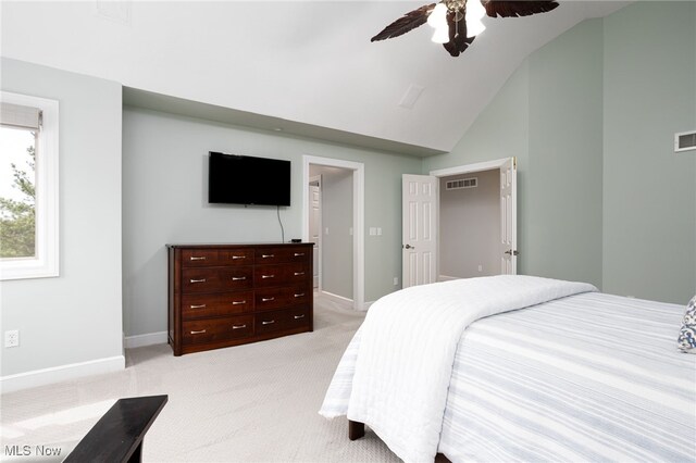 bedroom with a ceiling fan, visible vents, light carpet, and baseboards