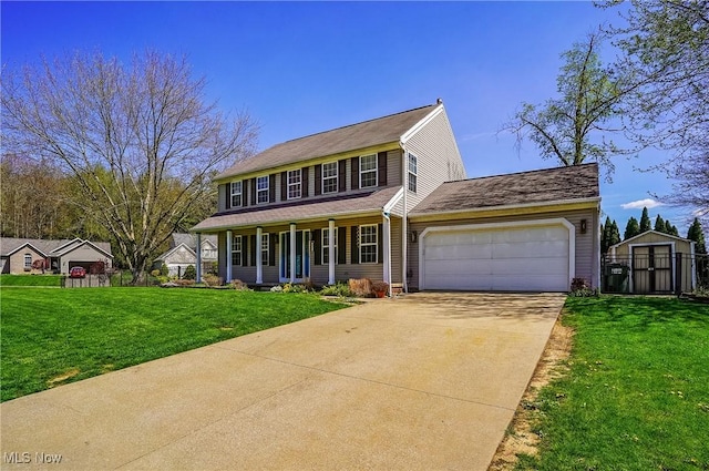 view of front of home featuring driveway, a shed, covered porch, an attached garage, and a front lawn
