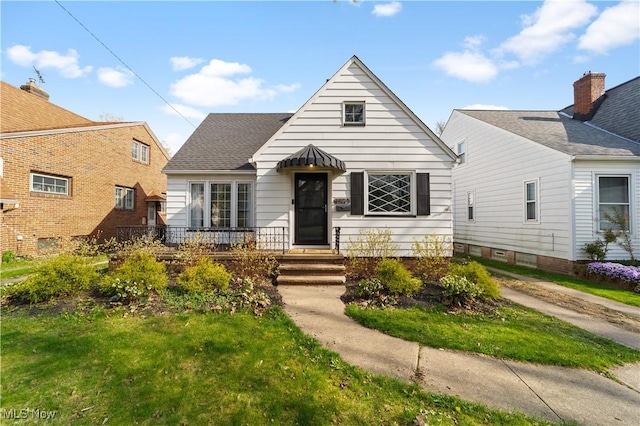 bungalow with a front lawn