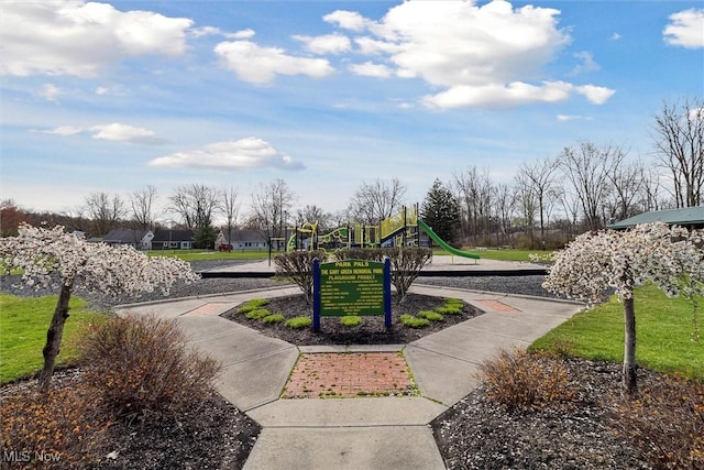 view of home's community featuring playground community