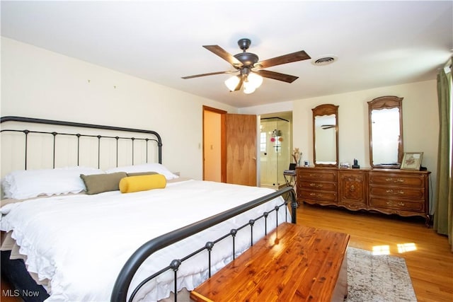 bedroom with visible vents, ceiling fan, and light wood-style floors