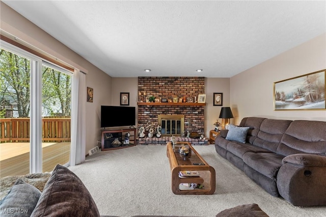 carpeted living area featuring a fireplace