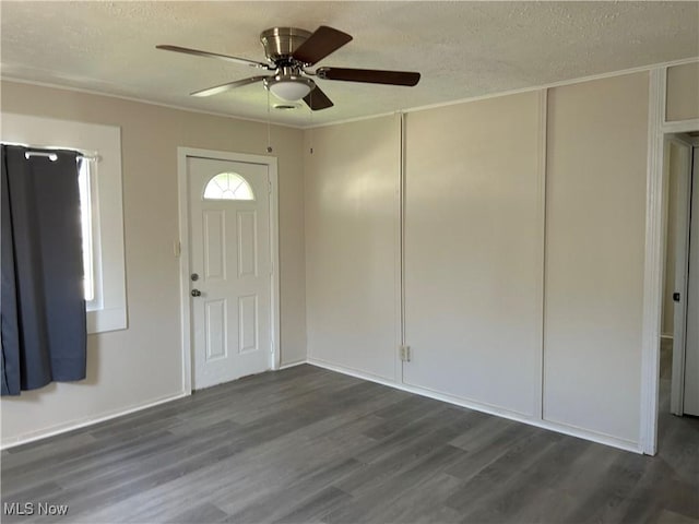 13505 Carrington Ave, Cleveland, OH 44135 - foyer featuring dark wood finished floors, a ceiling fan, a textured ceiling, and crown molding
