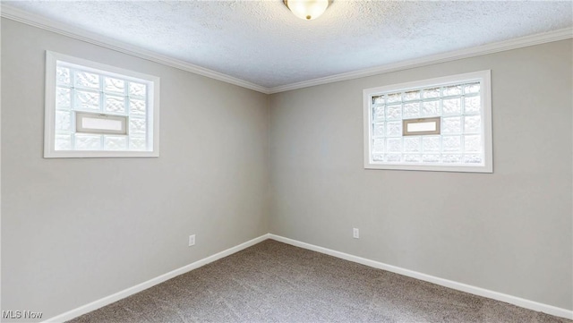unfurnished room featuring a textured ceiling, a healthy amount of sunlight, carpet flooring, and baseboards