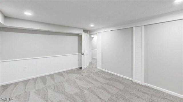 finished below grade area with recessed lighting, carpet flooring, and baseboards