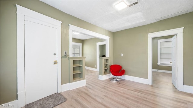 636-638 Fern St, Akron, OH 44307 - entrance foyer featuring light wood-style floors, baseboards, and a textured ceiling
