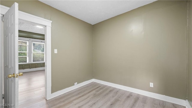 636-638 Fern St, Akron, OH 44307 - spare room featuring baseboards and light wood-style floors