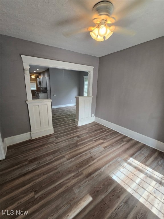 636-638 Fern St, Akron, OH 44307 - empty room featuring dark wood finished floors, ceiling fan, baseboards, and a textured ceiling