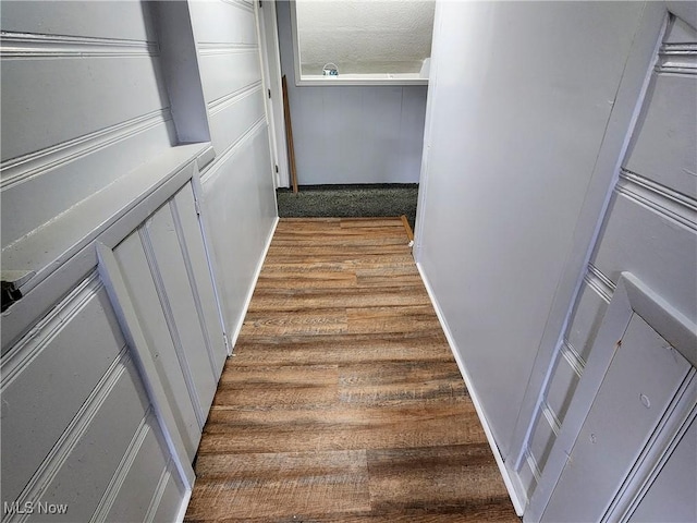 corridor with wood finished floors