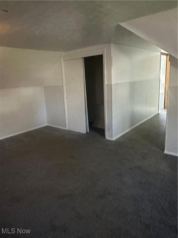 1765 E 238th St, Euclid, OH 44117 - additional living space with baseboards and dark colored carpet