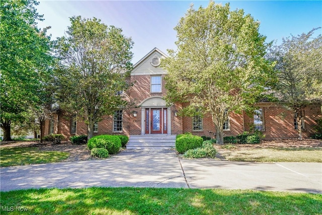 view of front of home with brick siding