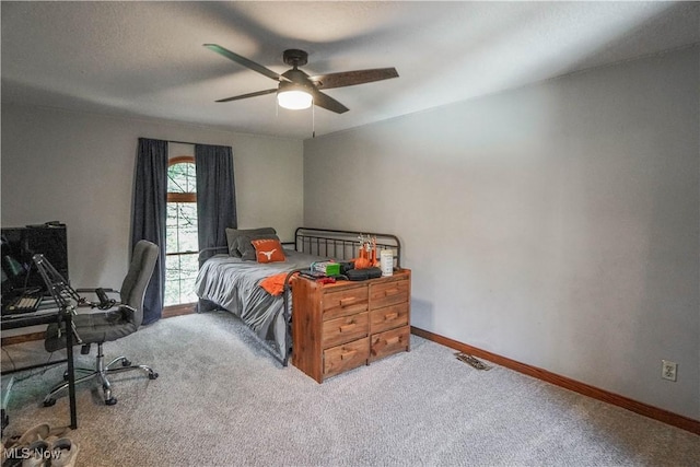 carpeted bedroom featuring visible vents, ceiling fan, and baseboards