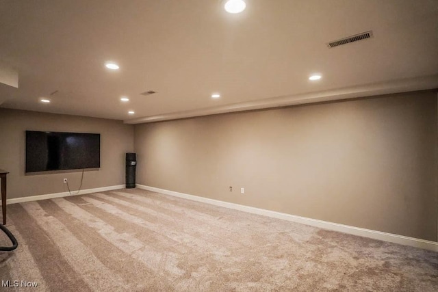 finished below grade area featuring recessed lighting, visible vents, and carpet floors
