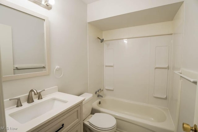 full bath with toilet, vanity, and  shower combination