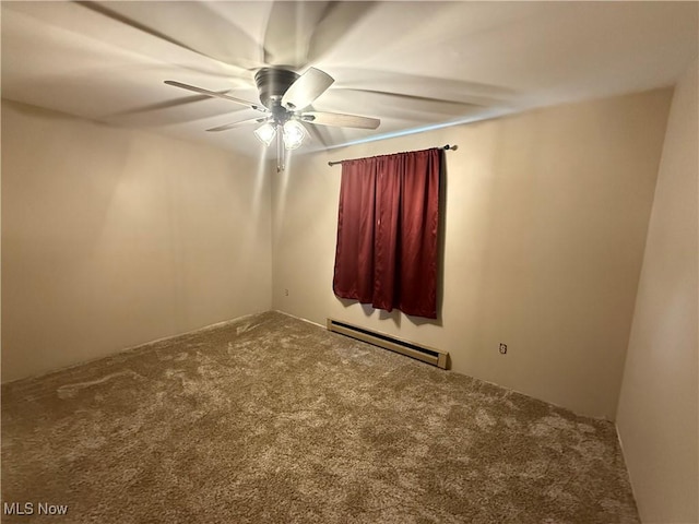 spare room featuring a baseboard heating unit, carpet flooring, and ceiling fan
