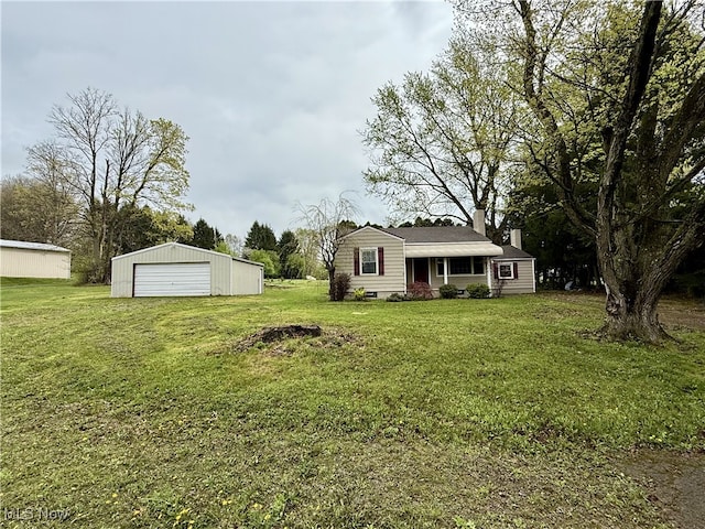 view of yard featuring an outbuilding and a garage