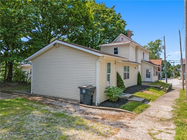view of side of property featuring a chimney
