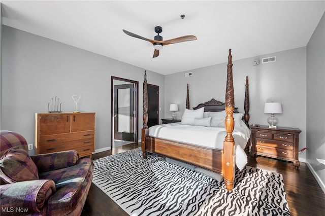 bedroom with visible vents, ceiling fan, wood finished floors, and baseboards