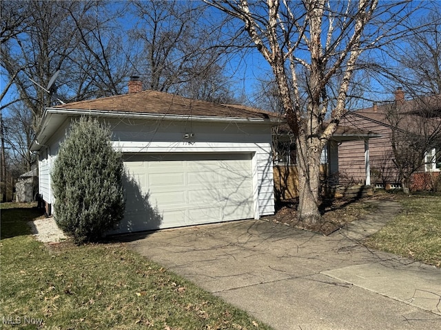 garage with aphalt driveway