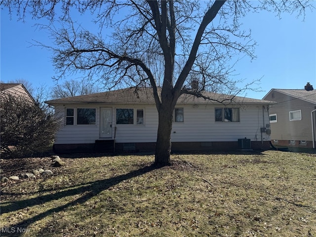 rear view of property featuring central AC and entry steps