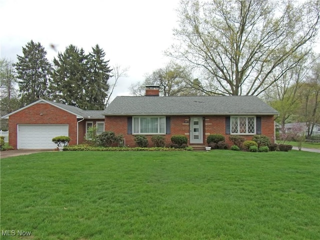single story home with a front lawn, a chimney, brick siding, and an attached garage