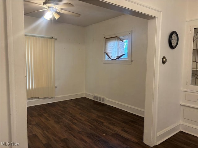 12608 Corlett Ave, Cleveland, OH 44105 - unfurnished room featuring baseboards, dark wood finished floors, ceiling fan, and visible vents