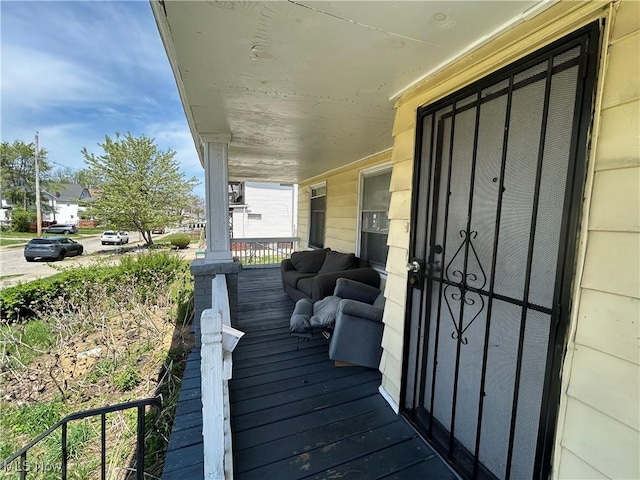 693 E 130th St, Cleveland, OH 44108 - deck featuring a porch