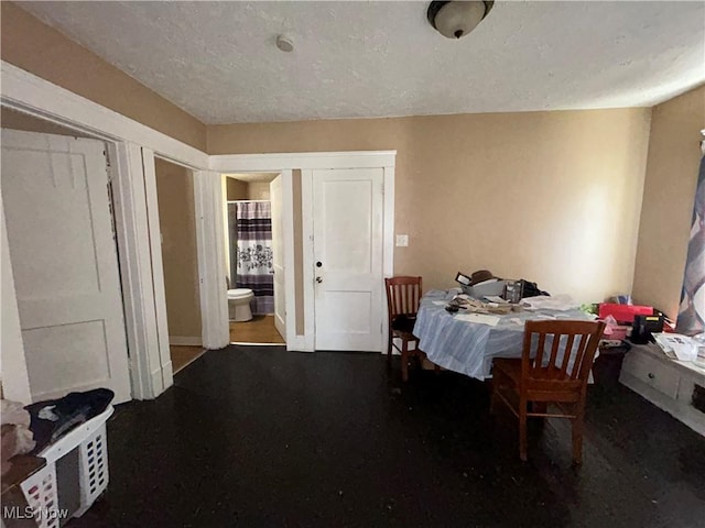 693 E 130th St, Cleveland, OH 44108 - dining area featuring a textured ceiling