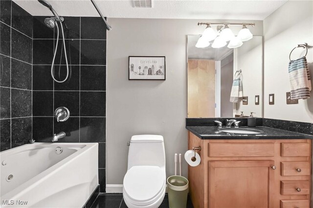 bathroom featuring vanity, toilet, visible vents, tile patterned flooring, and  shower combination